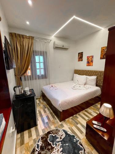 a hotel room with a bed and a window at Basha Pyramids Best View in Giza