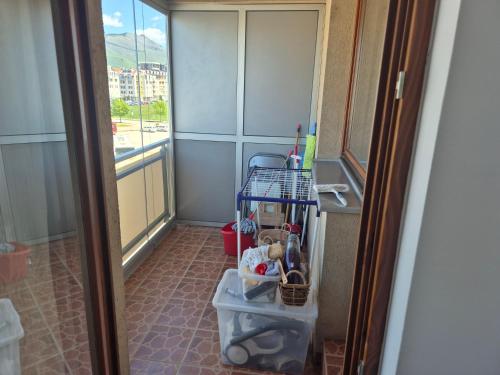 a small room with a hallway with a door open at Apartman Dobrinja in Sarajevo