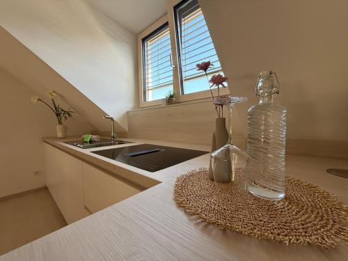 a bottle of water on a table in a kitchen at Donau Vibes Luxury Family near City and Highway in Linz