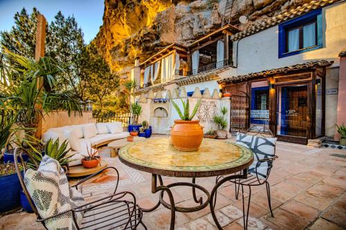 an outdoor patio with a table and chairs at XUQ Hotels Alaxara in Cubas