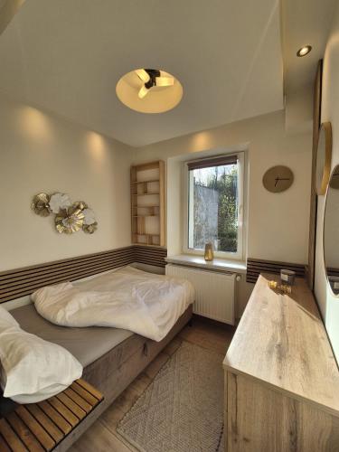 a bedroom with two beds and a window at DORMAR II Apartament in Wałbrzych