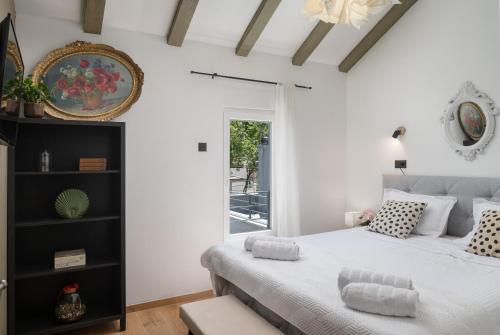 a bedroom with a large bed and a window at Luxury Villa Andrea Vrzika in forest near the sea with heated pool in Zagvozd