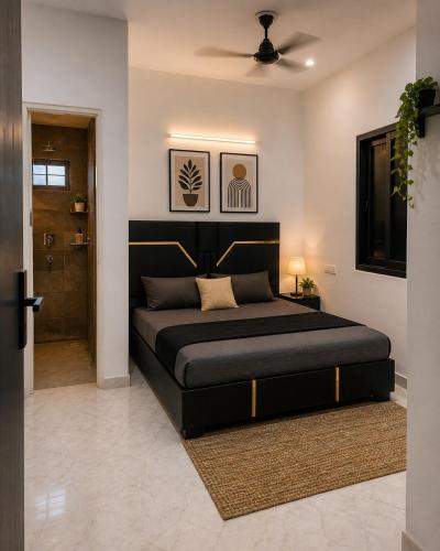 a bedroom with a bed and a ceiling fan at BTL Kamakshi homez , 3bhk free parking, open dining, balcony in Ludhiana