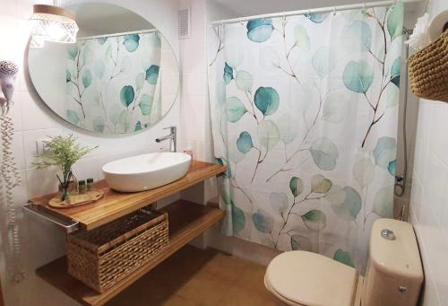 a bathroom with a sink and a mirror at Apartamentos Gelimar in Puerto Rico de Gran Canaria