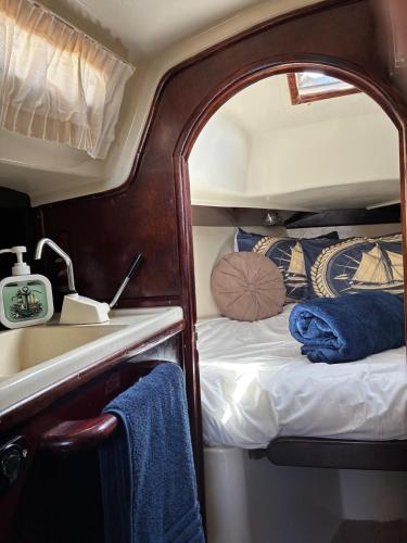 a small room with a bed and a mirror at Ulia in Arrecife
