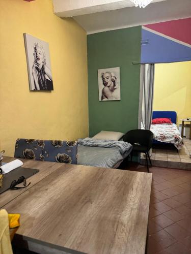 a room with a bed and a table in a room at Demane-bebbih in Étouars