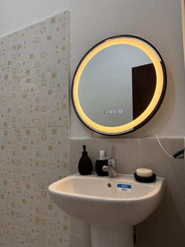 a bathroom with a sink and a mirror on the wall at Dar Ifrane in Ifrane