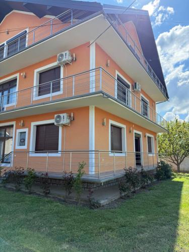 a building with balconies on the side of it at Zdravo Homolje in Petrovac na Mlavi