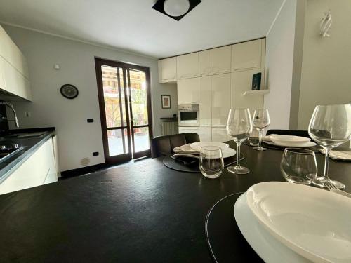 a kitchen with a table with wine glasses on it at Ca Rene in Savigliano