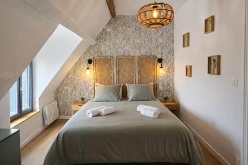 Llit o llits en una habitació de Le Clos des Instants