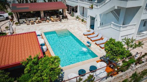 an overhead view of a swimming pool in a building at Villa JOSANA in Sarandë