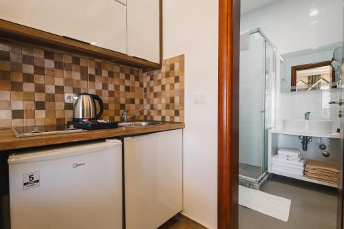 a kitchen with a sink and a counter top at Apartments Kan in Ulcinj