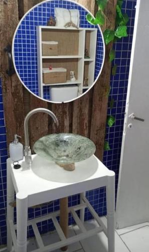 a bathroom with a sink and a mirror at Chalet para 7 en Mar del Plata con parque y parrilla in Mar del Plata