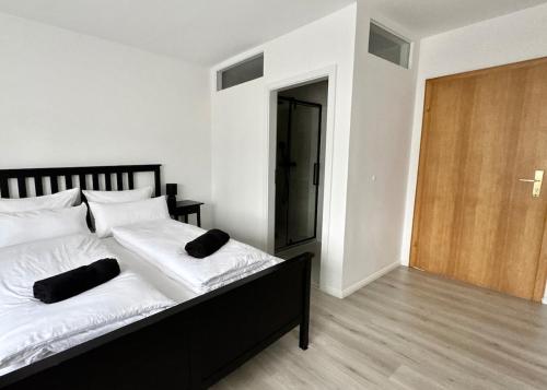 a bedroom with a bed with two pillows on it at PW38 Studio Koblenz in Koblenz