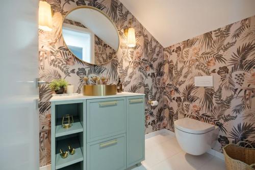 a bathroom with a sink and a mirror at Vanda Heights in Queenstown