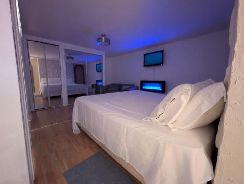 a bedroom with a large white bed in a room at Home rental S7 in Saint Maurice