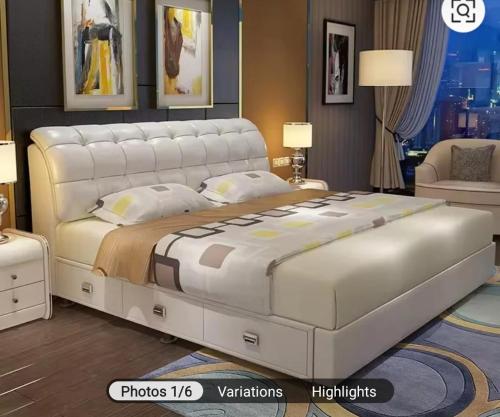 a bedroom with a large white bed in a room at Nuria luxurious one bed room apartment in Sekondi-Takoradi