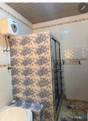 a bathroom with a shower and a toilet in it at Nuria luxurious one bed room apartment in Sekondi-Takoradi