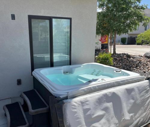 a bath tub sitting in front of a building at Spacious 5BR Resort Waterpark Access Sleeps 16 in St. George