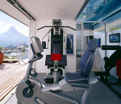 a gym with a treadmill and a bike at Atlanticview Cape Town Boutique Hotel in Cape Town