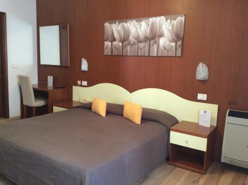 Кровать или кровати в номере Hotel Nuovo Parco