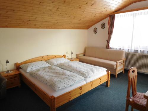 Ένα ή περισσότερα κρεβάτια σε δωμάτιο στο Urlaub am Bauernhof Blamauer Köhr