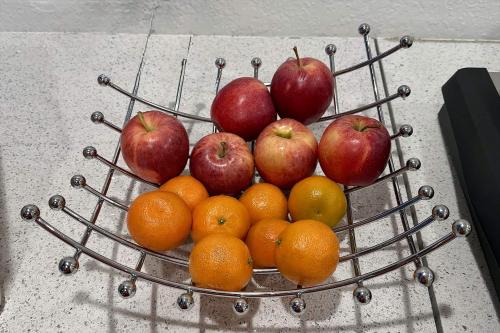 a basket of apples oranges and oranges on a table at Baymont by Wyndham Findlay in Findlay