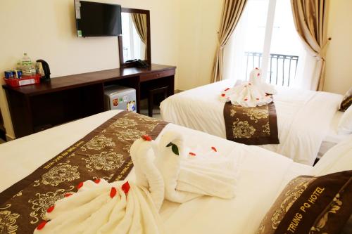 Cama o camas de una habitación en Quang Trung Phu Quoc Hotel
