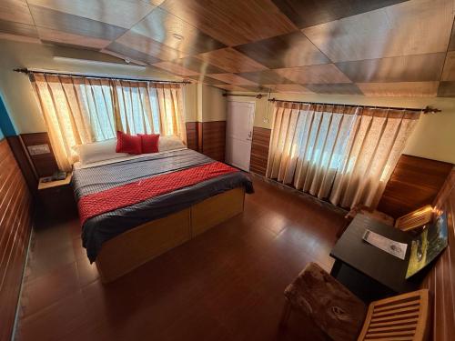 a bedroom with a large bed in a boat at Hotel Buro The Gate in Kalpa