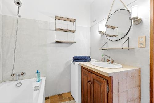 a bathroom with a sink and a mirror at Le Domaines Des Thermes - T2 in Gap