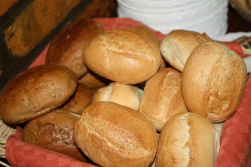 a pile of buns sitting in a basket at Pension Hotel Sartor in Kurort Altenberg