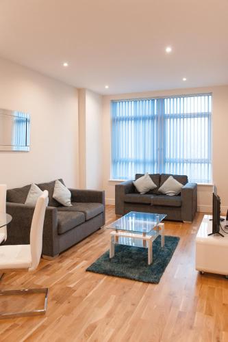 a living room with two couches and a coffee table at PSF Panorama Apartments in Ashford