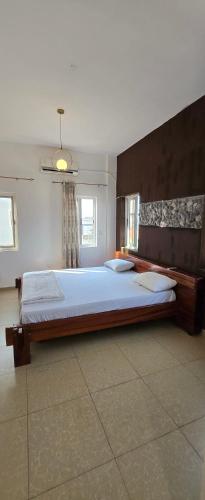 a large bedroom with a large bed in it at Modern Secured Condo Apartments 1 in Tema