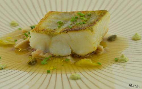 a white plate with a piece of food on it at La Tronera del Bierzo Restaurante-Hotel in Villadepalos