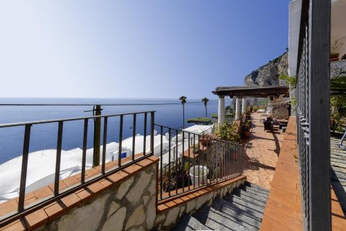a balcony with a view of the water at Essence One by Sweet Capri in Capri