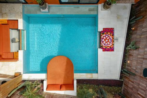 a lego house with a swimming pool and a sink at Sana Vie Villa Seminyak by Ini Vie Hospitality in Seminyak
