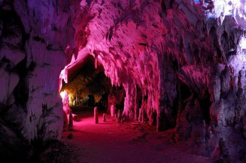 a dark cave with pink lights in it at L'Oasi in Auletta