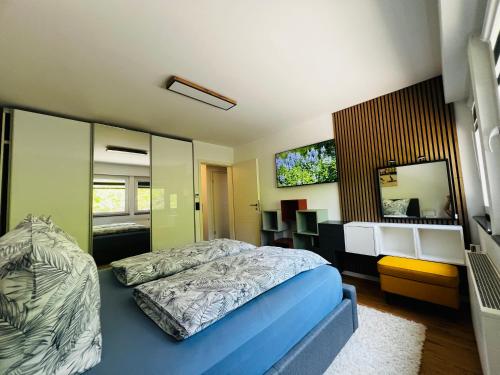 a bedroom with a bed and a mirror at Traum Berg - Koppelberg 2 in Traben-Trarbach