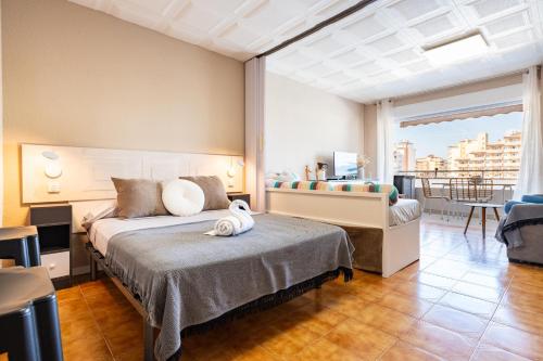 a hotel room with a bed and a balcony at Azul Turquesa in Peniscola