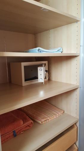 a small cabinet with a microwave in a closet at Studio Mira Mare in Sal Rei