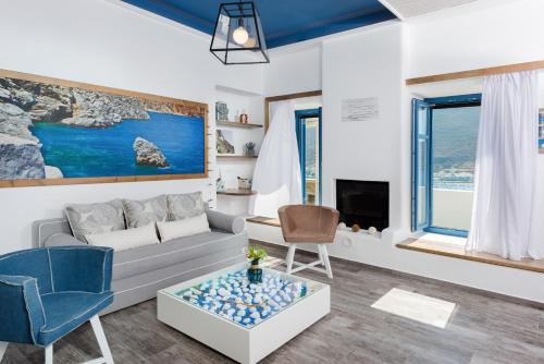 a living room with a couch and a table at Kaerati Apartments in Katapola