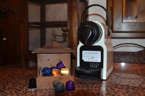 a bottle of wine sitting on a counter next to a candle at Cuor di borgo in Apricale