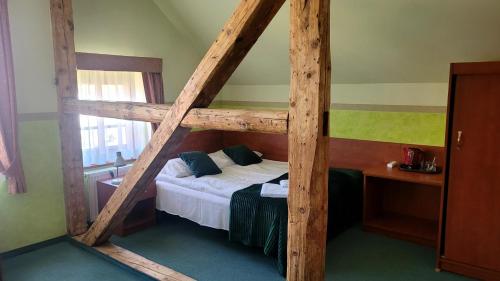 a bedroom with a bunk bed in a room at Willa Akme in Stronie Śląskie