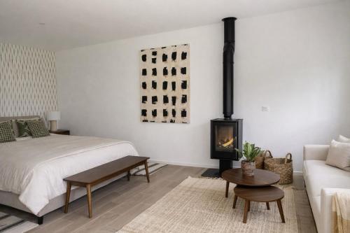 a bedroom with a bed and a fireplace at Hospedería Quinta de Cavia in Cabia