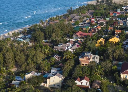 an aerial view of a residential neighborhood next to the ocean at Heritage Gem Boutique Villa in Hoi An