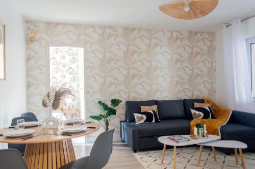 a living room with a couch and a table at The Graoully's Cave - Hyper Centre in Metz