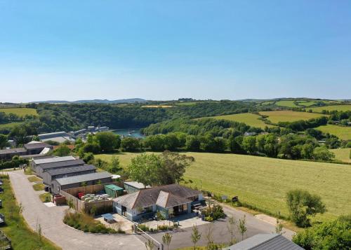an aerial view of a house in a field at Penmarlam Lodge Retreat in Fowey