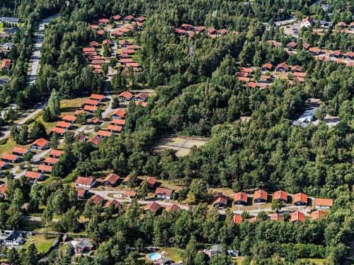 an aerial view of a residential neighborhood in a forest at 6 person holiday home in Væggerløse in Bøtø By