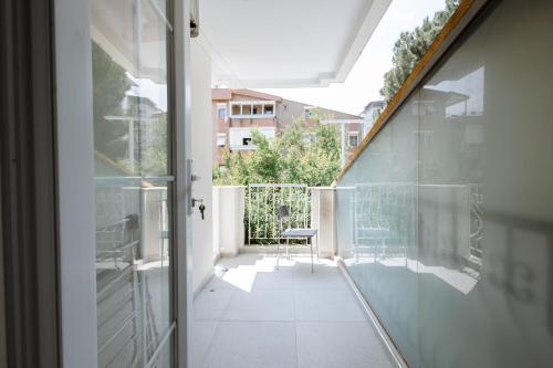 a balcony with a view of a building at Arya Pansiyon Konyaaltı in Antalya