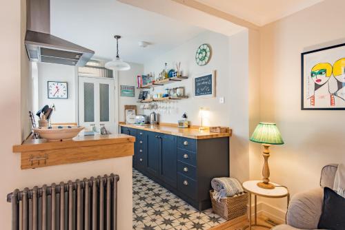 a kitchen with a counter and a sink in a room at Star Cottage in Whitstable